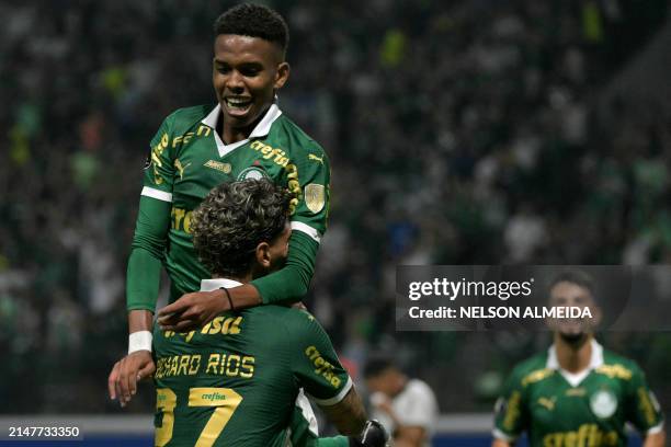 Palmeiras' forward Estevao Willian celebrates with teammate Colombian midfielder Richard Rios after scoring a goalfight for the ball during the Copa...