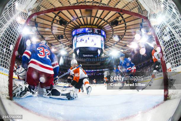 Jonathan Quick of the New York Rangers makes a save against Joel Farabee of the Philadelphia Flyers at Madison Square Garden on April 11, 2024 in New...