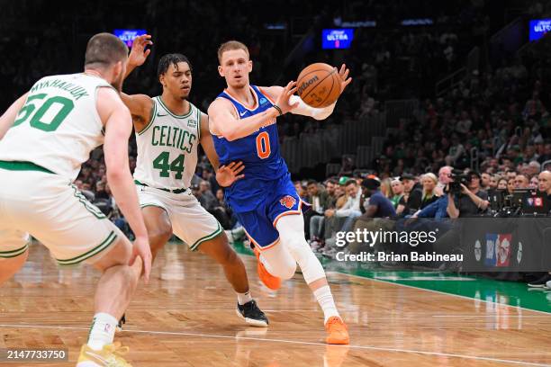 Donte Divincenzo of the New York Knicks passes the ball during the game against the Boston Celtics on April 11, 2024 at the TD Garden in Boston,...