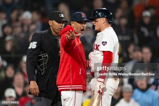 Manager Alex Cora reacts as Reese McGuire of the Boston Red Sox is ejected from the game by home plate umpire Jeremie Rehak after arguing a called...