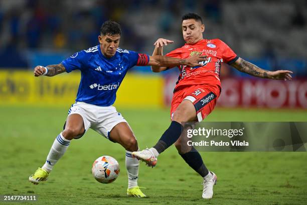 Lucas Romero of Cruzeiro and Sebastian Acosta of Alianza Petrolera fight for the ball during a match between Cruzeiro and Alianza Petrolera as part...