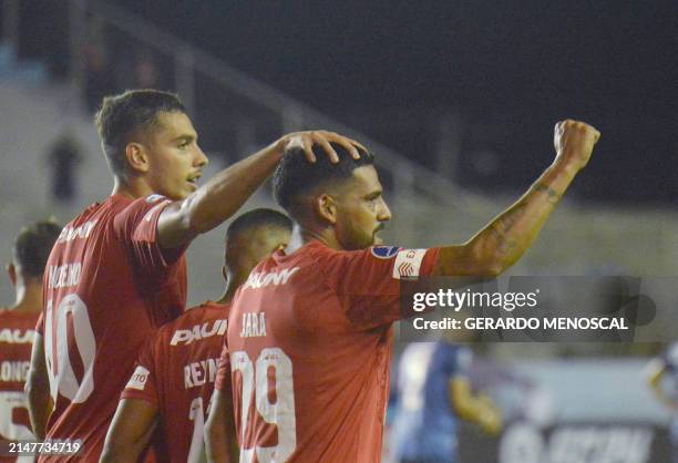 Belgrano's forward Franco Jara celebrates after scoring a goal during the Copa Sudamericana group stage first leg match between Ecuador's Delfin and...