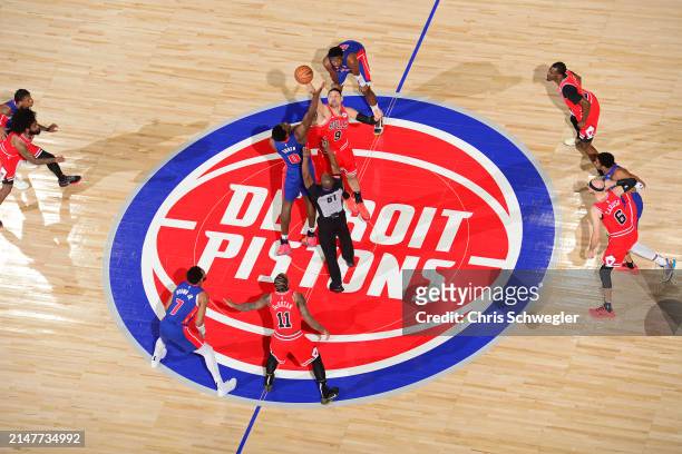 Nikola Vucevic of the Chicago Bulls and Jalen Duren of the Detroit Pistons go for the opening tip off during the game on April 11, 2024 at Little...