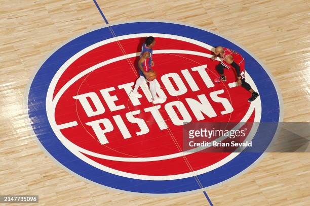 Marcus Sasser of the Detroit Pistons handles the ball during the game against the Chicago Bulls on April 11, 2024 at Little Caesars Arena in Detroit,...