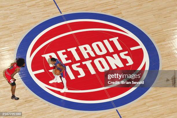 Marcus Sasser of the Detroit Pistons handles the ball during the game against the Chicago Bulls on April 11, 2024 at Little Caesars Arena in Detroit,...