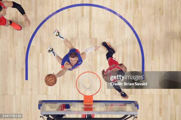 Malachi Flynn of the Detroit Pistons shoots the ball during the game against the Chicago Bulls on April 11, 2024 at Little Caesars Arena in Detroit,...