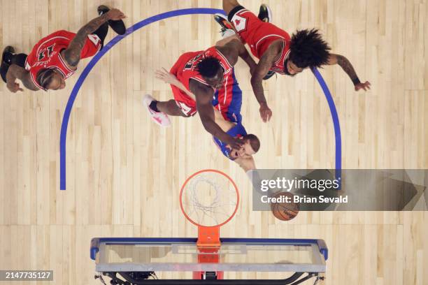 Malachi Flynn of the Detroit Pistons shoots the ball during the game against the Chicago Bulls on April 11, 2024 at Little Caesars Arena in Detroit,...