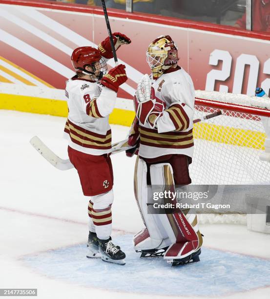 Lukas Gustafsson and Jacob Fowler of the Boston College Eagles celebrate a win against the Michigan Wolverines during the NCAA Men's Hockey Frozen...