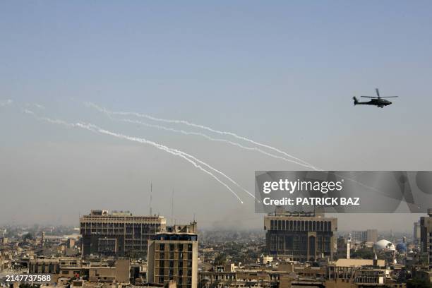Apache helicopter drops flares as it flies over Baghdad 03 March 2006. Iraqi security forces launched an operation today to kill or capture an...