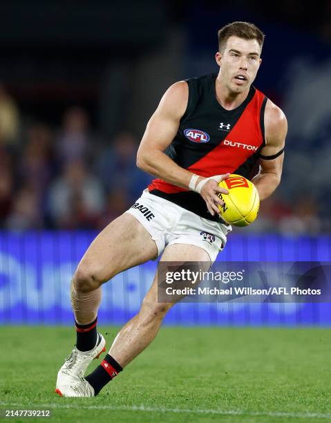 Zach Merrett of the Bombers in action during the 2024 AFL Round 05 match between the Western Bulldogs and the Essendon Bombers at Marvel Stadium on...