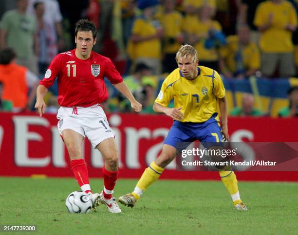 June 20: Niclas Alexandersson of Sweden and Wayne Rooney of England challenge during the FIFA World Cup Finals 2006 Group B match between Sweden and...