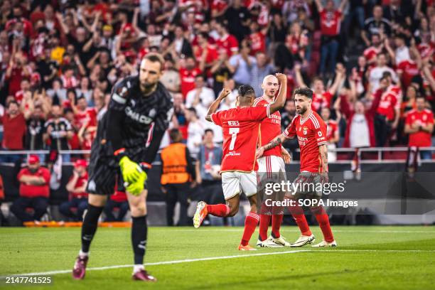 Rafa Silva , Fredrik Aursnes and David Neres of SL Benfica celebrate a goal during the UEFA Europa League quarterfinal first leg match between SL...