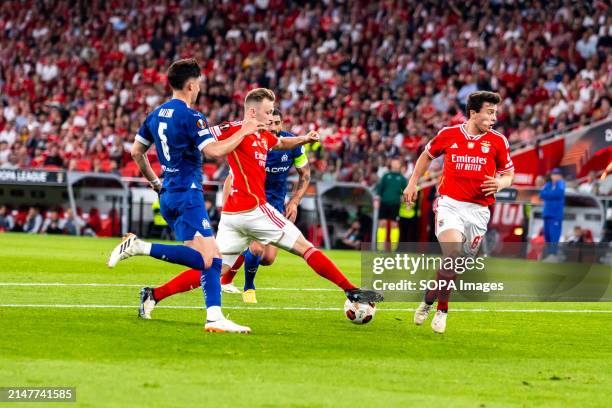 Leonardo Balerdi of Marseille, Casper Tengstedt and Joao Neves of Benfica seen in action during the UEFA Europa League 2023/24 match between SL...