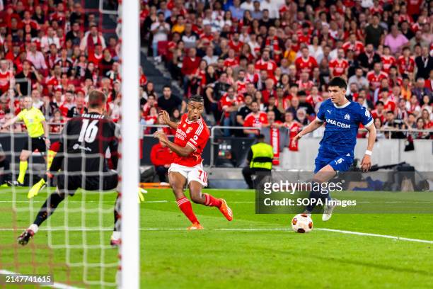Pau Lopez David Neres and Leonardo Balerdi of Marseille seen in action during the UEFA Europa League 2023/24 match between SL Benfica and Olympique...