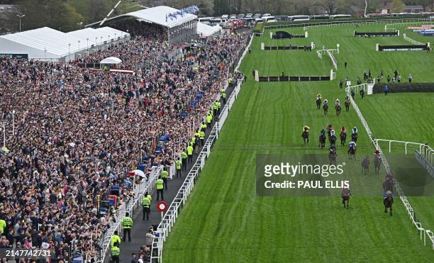 Jockey Harry Skelton rides Kateira to win the William Hill Handicap Hurdle race on the second day of the Grand National Festival horse race meeting...