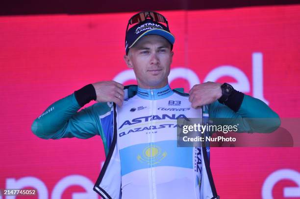 Alexey Lutsenko of Kazakhstan and Astana Qazaqstan Team wearing leader of the Mountain Grand Prix green jersey on podium during the 2024 Giro...