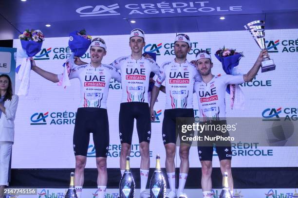 Pavel Sivakov of Russia, Adam Yates of Great Britain, Diego Ulissi of Italy, Jan Christen of Switzerland and UAE Team Emirates reacting on podium...