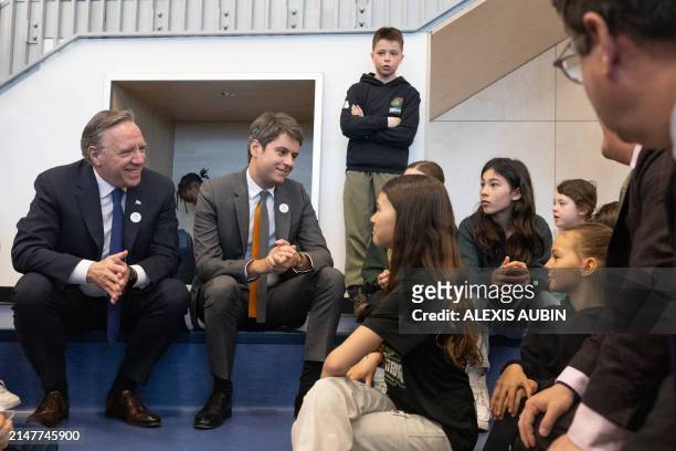 French Prime Minister Gabriel Attal and Quebec Premier Francois Legault speak with students at the De L'ancrage Elementary School in Quebec City,...