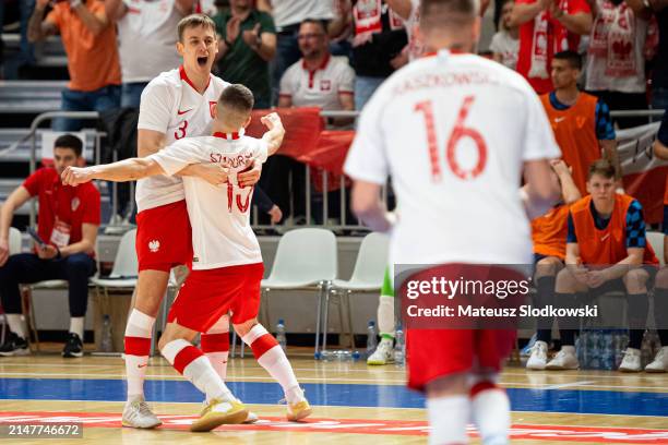 Sebastian Szadurski of Poland and Mateusz Madziag of Poland celebrates after scoring during the FIFA World Cup 2024 Play Off match between Poland and...