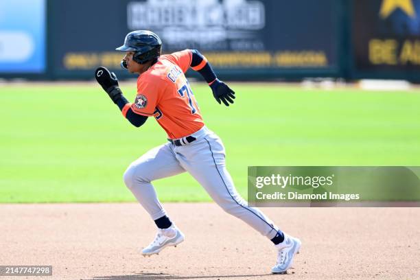 Kenni Gomez of the Houston Astros runs to second base during the sixth inning of a spring training Spring Breakout game against the St. Louis...