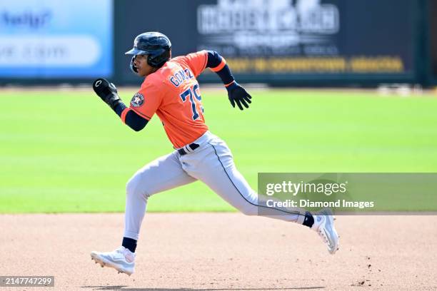 Kenni Gomez of the Houston Astros runs to second base during the sixth inning of a spring training Spring Breakout game against the St. Louis...