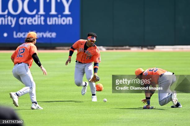 Kenni Gomez of the Houston Astros fields a fly ball during the sixth inning of a spring training Spring Breakout game against the St. Louis Cardinals...