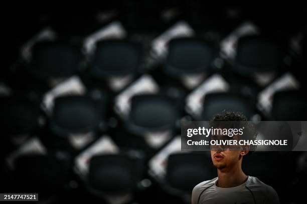 Bourg-en-Bresse's French forward Zaccharie Risacher looks on during a warm up session ahead of the Eurocup second leg basketball match between JL...