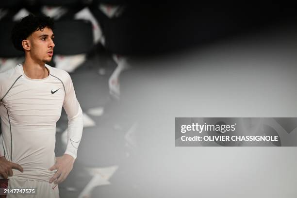 Bourg-en-Bresse's French forward Zaccharie Risacher looks on during a warm up session ahead of the Eurocup second leg basketball match between JL...