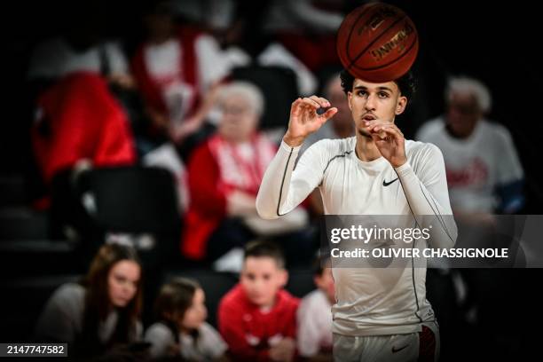 Bourg-en-Bresse's French forward Zaccharie Risacher takes part in a warm up session ahead the Eurocup second leg basketball match between JL Bourg...