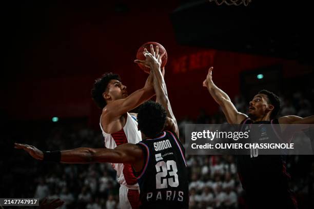 Bourg-en-Bresse's French forward Zaccharie Risacher shoots the ball during the Eurocup second leg basketball match between JL Bourg and Paris...