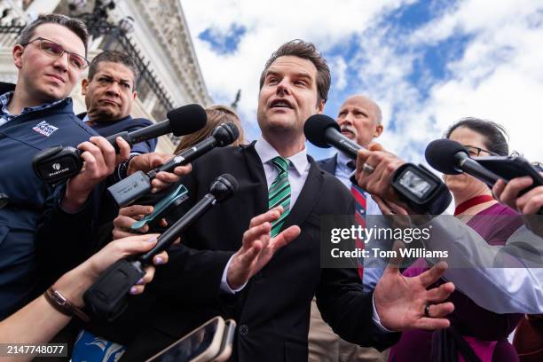 Reps. Matt Gaetz, R-Fla., center, and Chip Roy, R-Texas, talk with reporters outside the U.S. Capitol after the House reauthorized Section 702 of the...