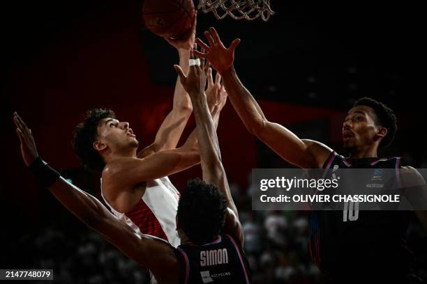 Bourg-en-Bresse's French forward Zaccharie Risacher fights for the ball with Paris' French point guard Mehdy Ngouama during the Eurocup second leg...