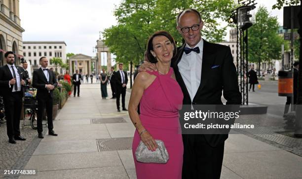 April 2024, Berlin: Friedrich Merz, Federal Chairman of the CDU, and his wife Charlotte Merz attend the 71st Federal Press Ball. The ball is...