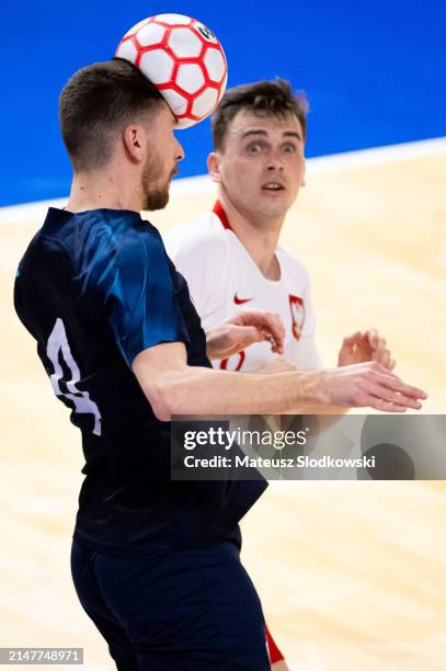 Duje Kustura of Croatia battle for the ball during the FIFA World Cup 2024 Play Off match between Poland and Croatia on April 12, 2024 in Koszalin,...