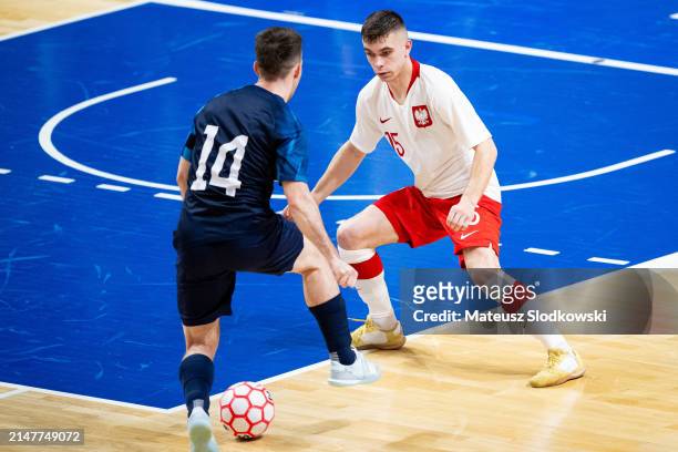 Sebastian Szadurski of Poland battle for the ball during the FIFA World Cup 2024 Play Off match between Poland and Croatia on April 12, 2024 in...