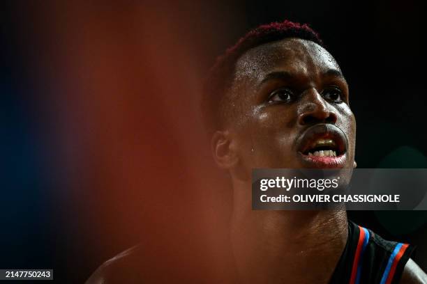 Paris' US guard Timothy Neocartes TJ Shorts II looks on during the Eurocup second leg basketball match between JL Bourg and Paris basketball at the...
