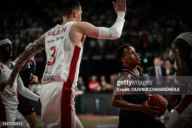 Paris' US point guard Timothy Neocartes TJ Shorts runs with the ball during the Eurocup second leg basketball match between JL Bourg and Paris...