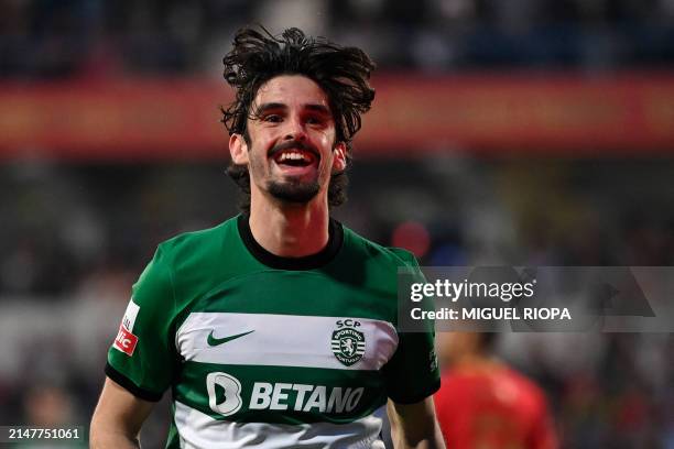 Sporting Lisbon's Portuguese forward Francisco Trincao celebrates after scoring his team's first goal during the Portuguese league football match...