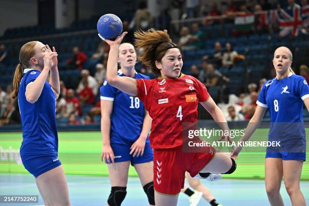 Japan's pivot Miyako Hatsumi scores during the women's Handball Olympic qualifying match between Japan and Britain in Debrecen, Hungary on April 12,...