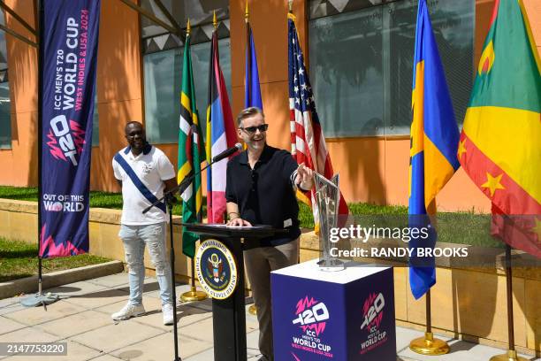 Ambassador to Barbados and the Eastern Caribbean Roger Nyhus speaks alongside Ashley Nurse of West Indies during the trophy tour for the ICC Men's...