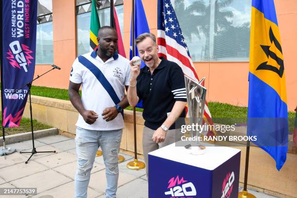 Ambassador to Barbados and the Eastern Caribbean Roger Nyhus gets bowling tips from Ashley Nurse of West Indies during the trophy tour for the ICC...