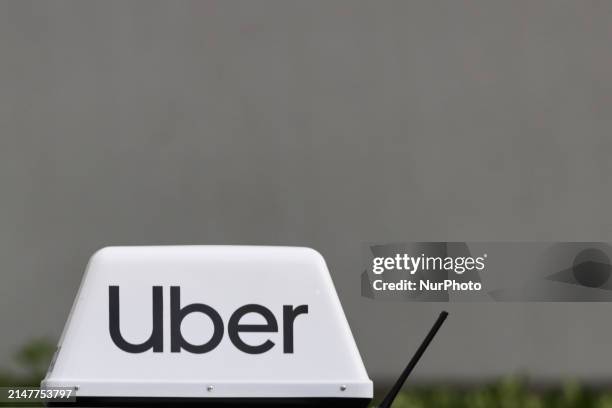 Uber sign is seen on a car in Warsaw, Poland on April 12, 2024.