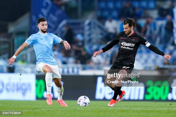 Taty Castellanos of SS Lazio and Antonio Candreva of US Salernitana compete for the ball during the Serie A TIM match between SS Lazio and US...