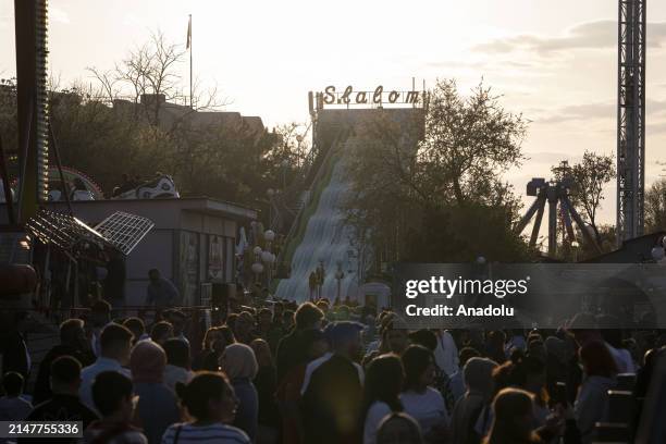 People enjoy the third day of the Eid al-Fitr holiday at an amusement park in Ankara, Turkiye on April 12, 2024.