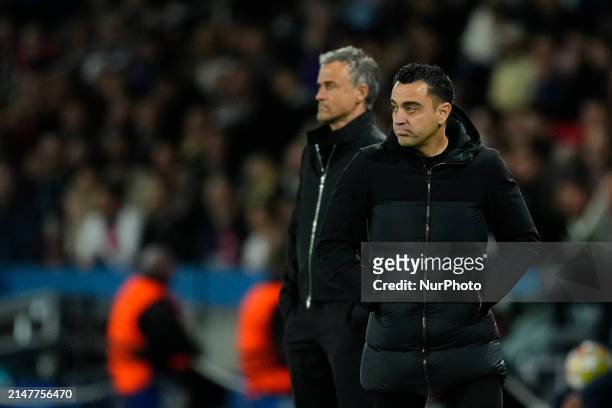 Xavi Hernandez head coach of Barcelona and Luis Enrique head coach of PSG during the UEFA Champions League quarter-final first leg match between...