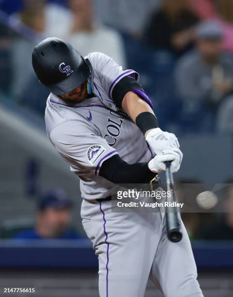 Kris Bryant of the Colorado Rockies hits a 2 RBI double in the fourth inning against the Toronto Blue Jays at Rogers Centre on April 12, 2024 in...