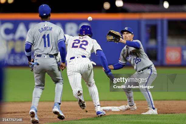 Brett Baty of the New York Mets is caught in a rundown between Maikel Garcia of the Kansas City Royals and Adam Frazier of the Kansas City Royals...