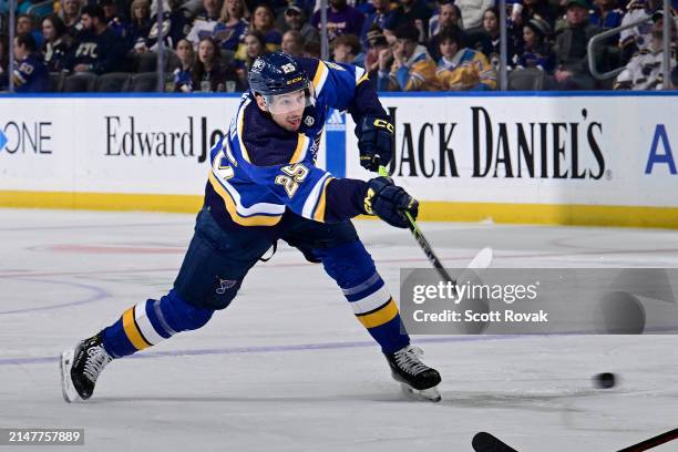 Jordan Kyrou of the St. Louis Blues takes a shot against the Carolina Hurricanes on April 12, 2024 at the Enterprise Center in St. Louis, Missouri.