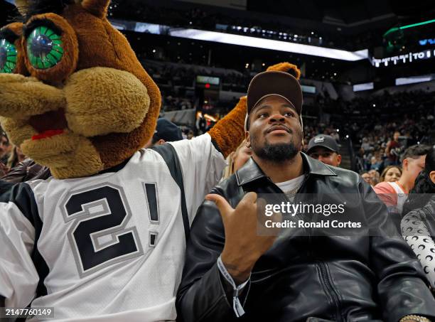 Micah Parsons of the Dallas Cowboys attends the game between the San Antonio Spurs and the Denver Nuggets in the first half at Frost Bank Center on...