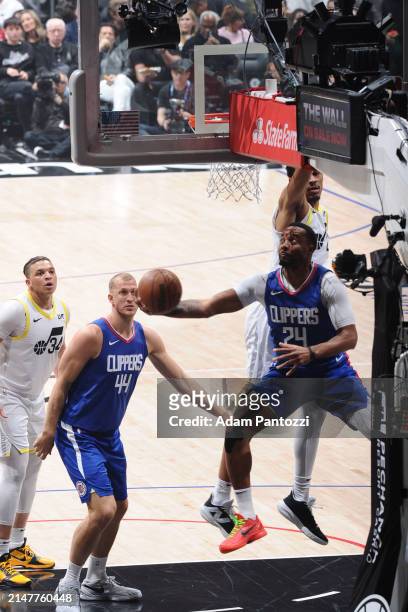 Norman Powell of the LA Clippers drives to the basket during the game against the Utah Jazz on April 12, 2024 at Crypto.Com Arena in Los Angeles,...